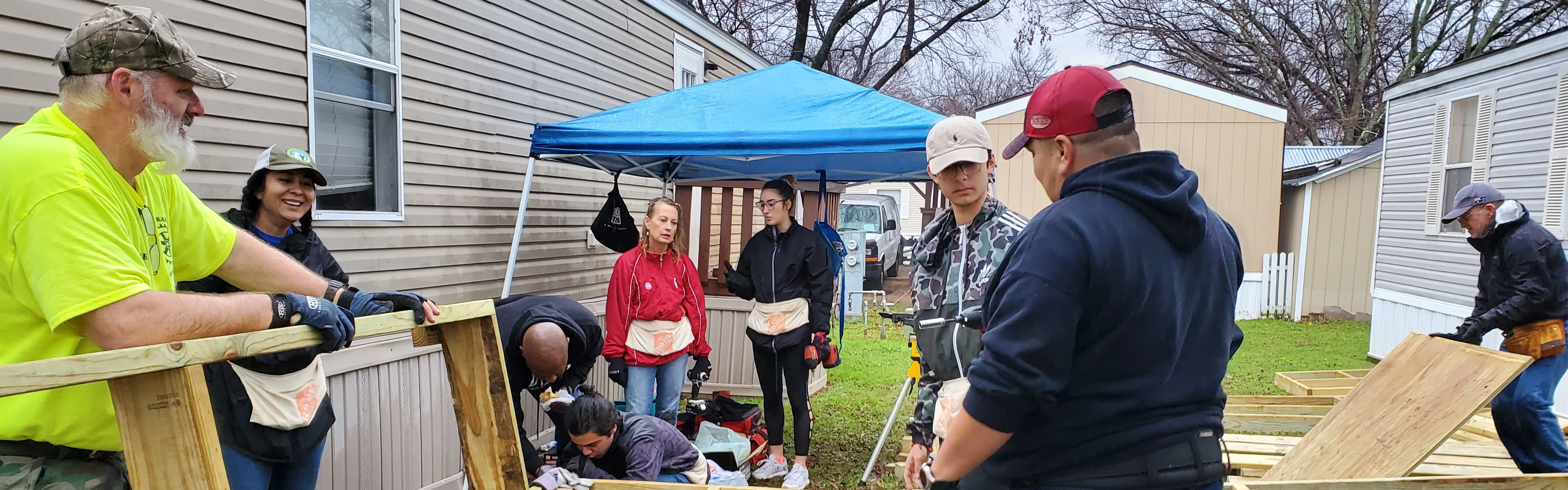 Rotary members building a wheelchair ramp for a Grand Prairie neighbor